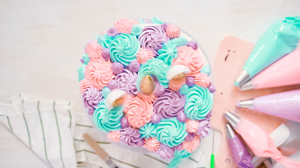 Piping pastel color buttercream rosettes